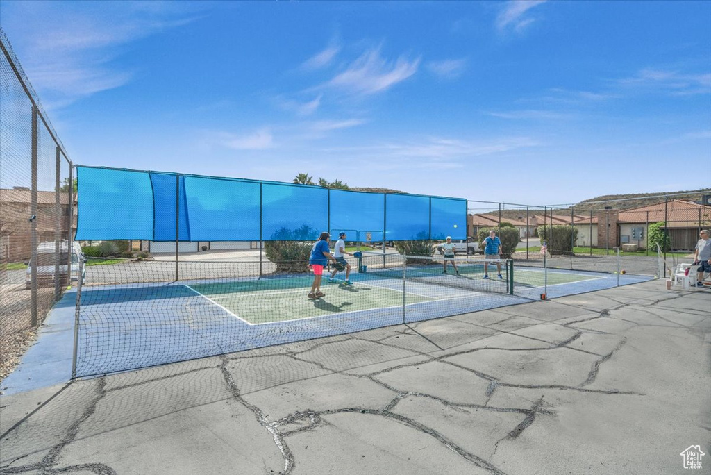 Exterior space featuring tennis court