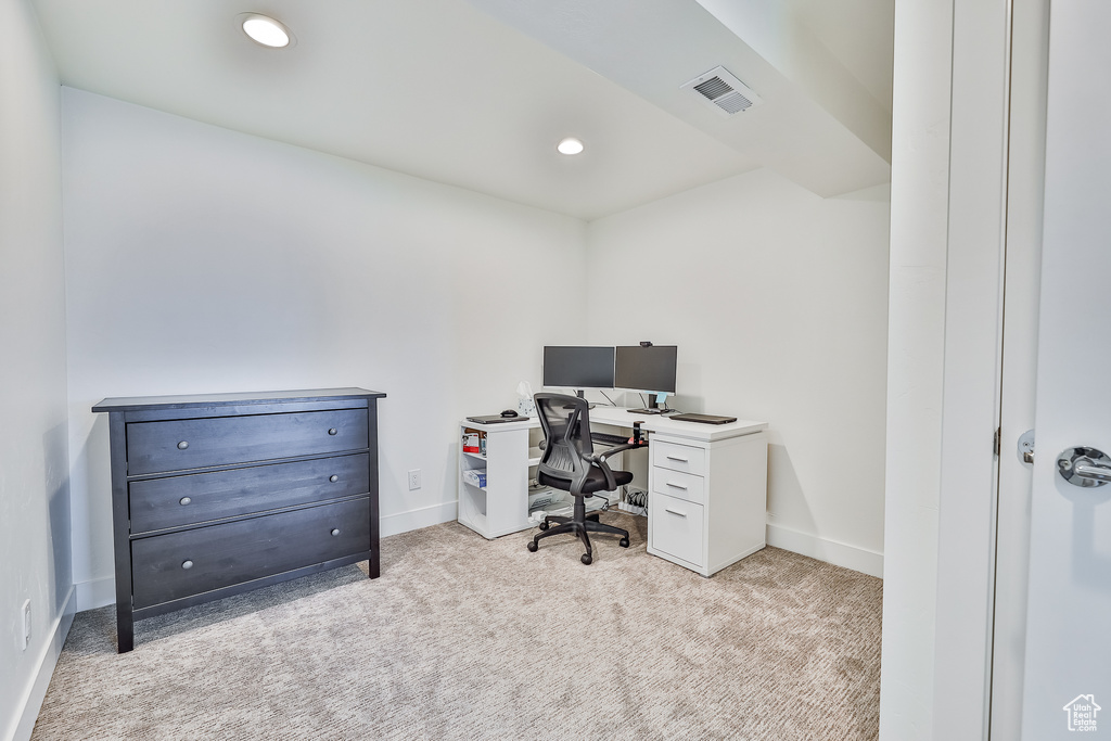 Office area with light colored carpet