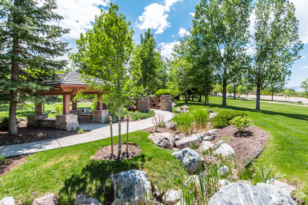 Surrounding community with a gazebo and a lawn