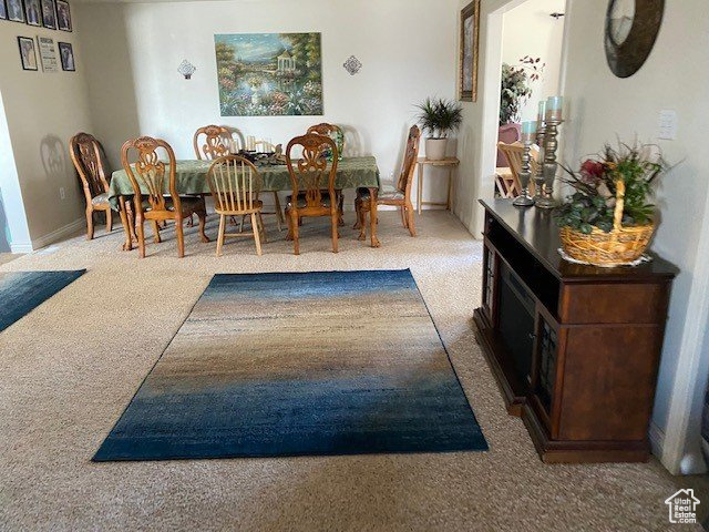 View of carpeted dining space
