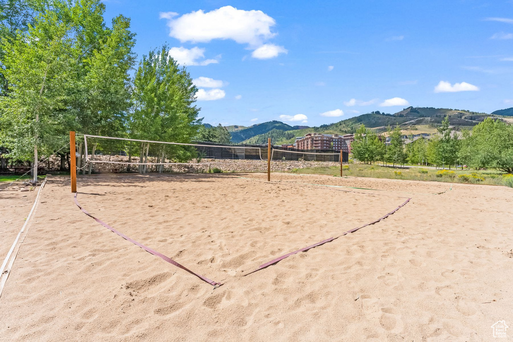 View of home's community with a mountain view and volleyball court