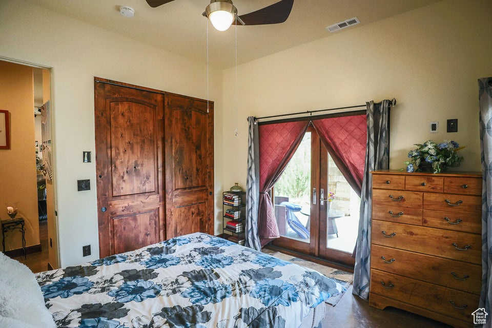 Bedroom featuring ceiling fan and access to exterior