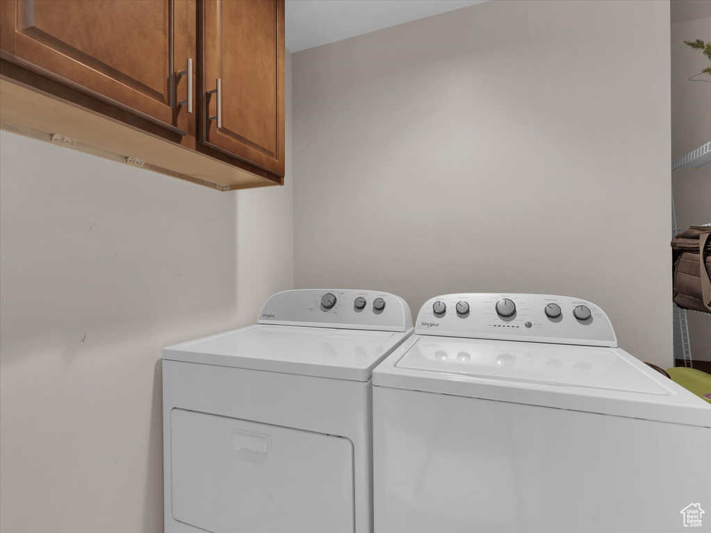 Washroom with independent washer and dryer and cabinets