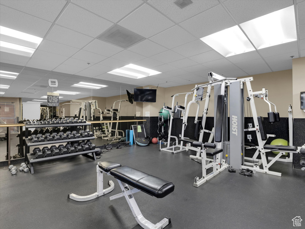 Workout area with a paneled ceiling