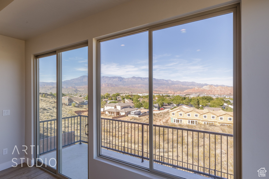 Doorway to outside with hardwood / wood-style floors and a mountain view