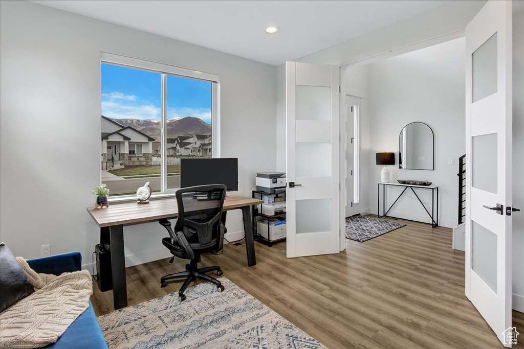 Office area featuring light hardwood / wood-style floors
