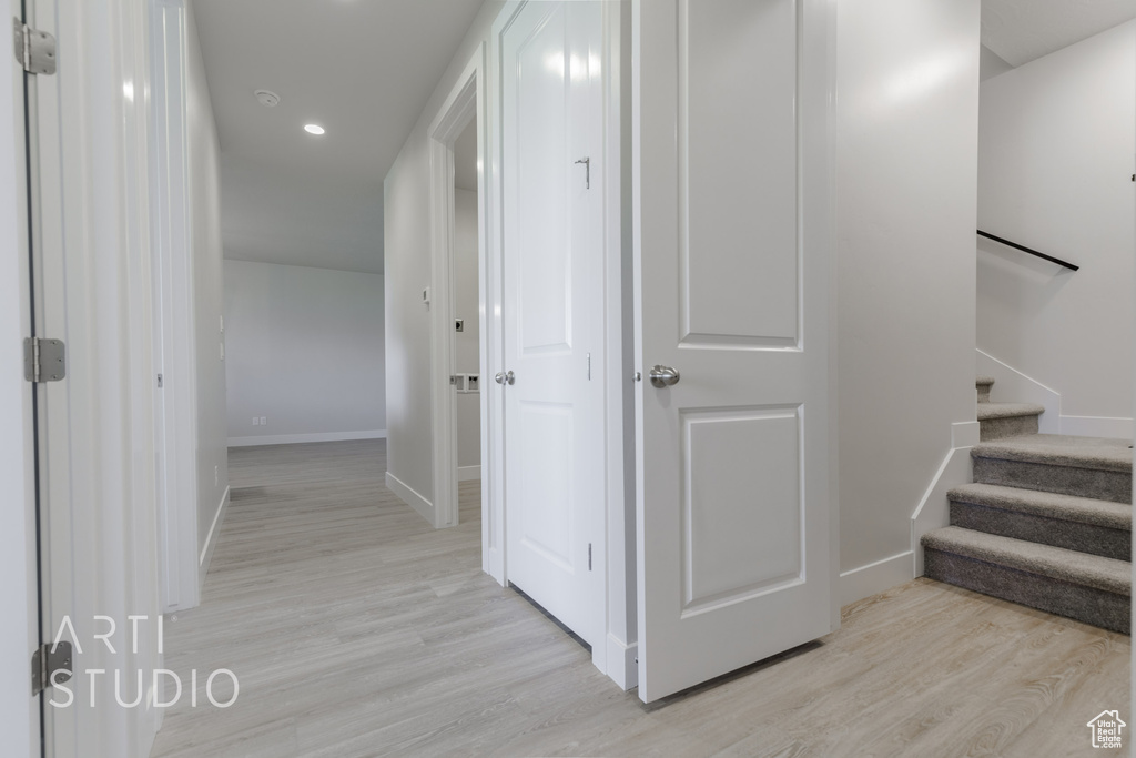 Hall featuring light wood-type flooring