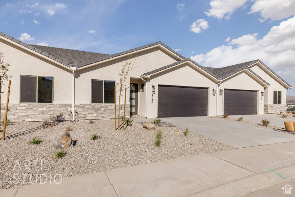 Ranch-style home featuring a garage