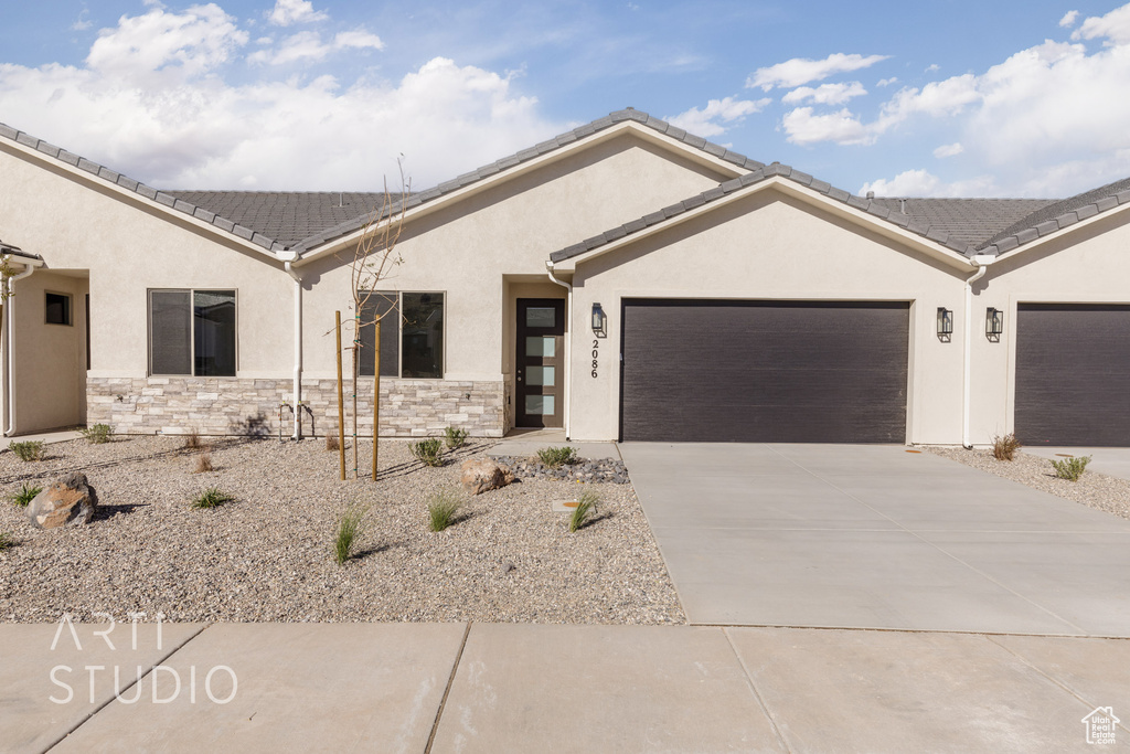 Ranch-style house featuring a garage