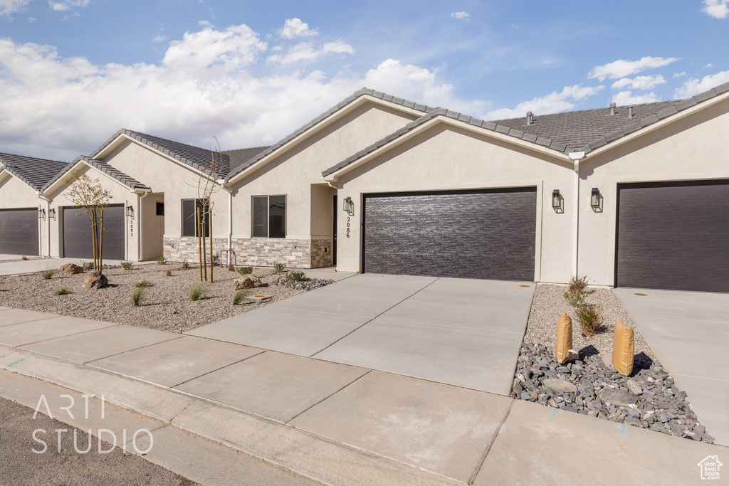 View of front of property featuring a garage