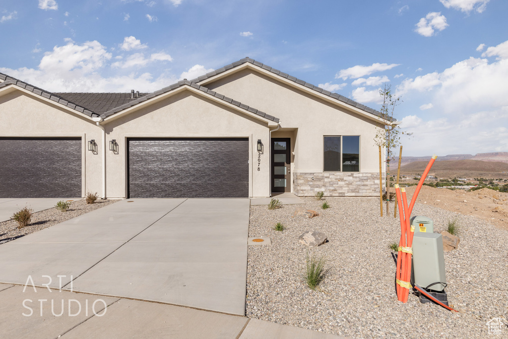 Ranch-style home featuring a garage