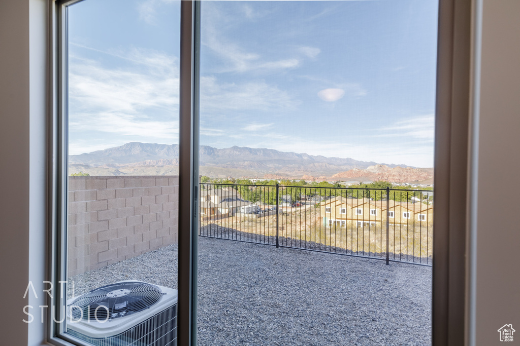 Interior space with cooling unit and a mountain view