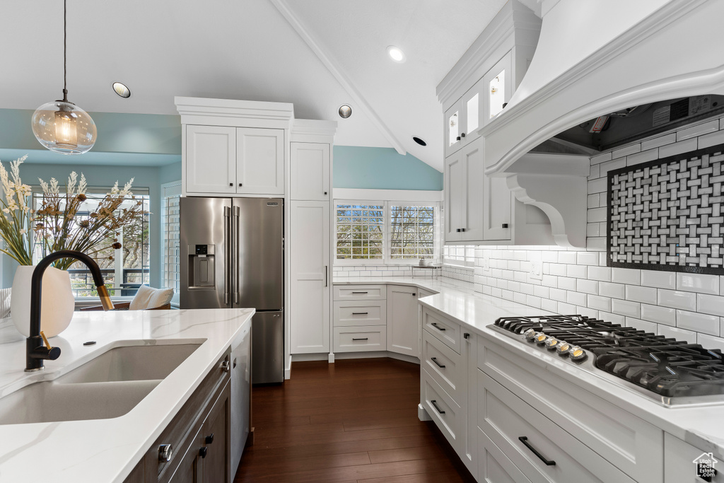 Kitchen with sink, backsplash, decorative light fixtures, dark hardwood / wood-style floors, and premium range hood