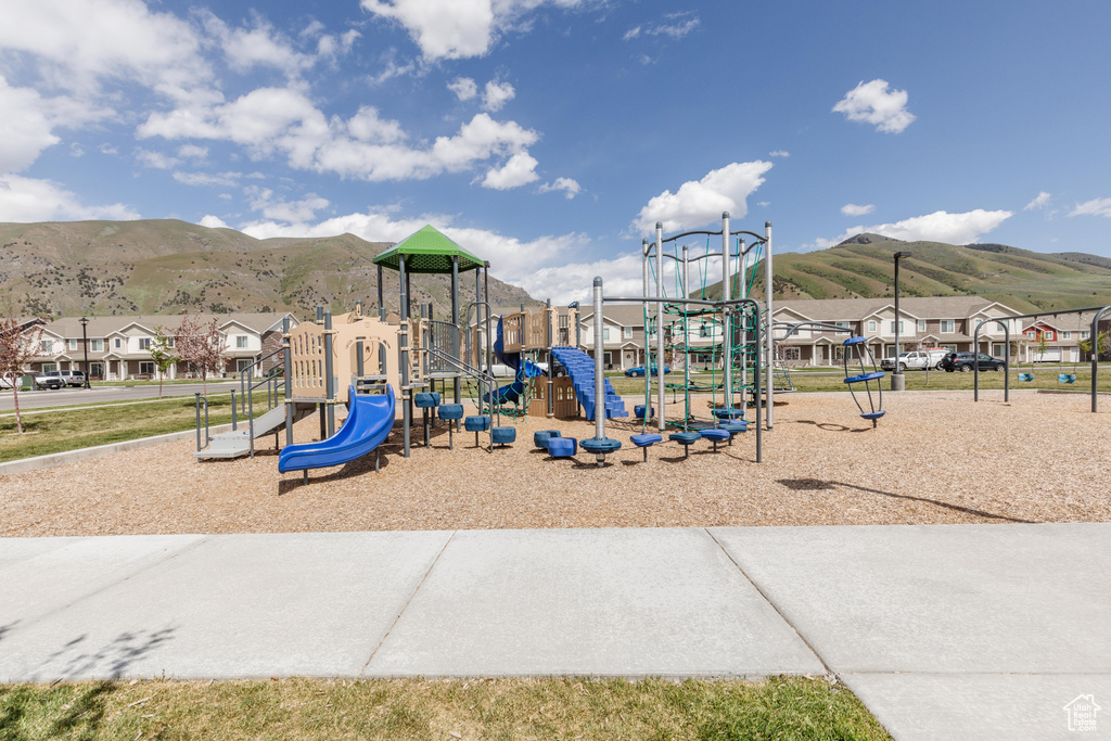 View of playground with a mountain view