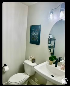 Bathroom featuring sink and toilet