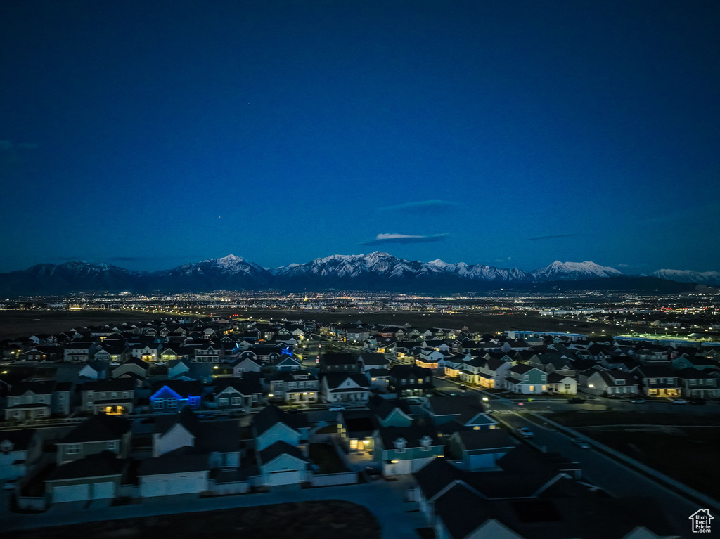 Aerial view at twilight featuring a mountain view