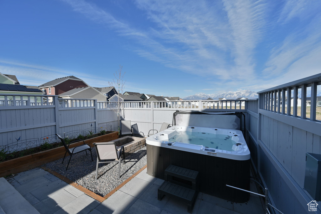 View of terrace featuring a hot tub