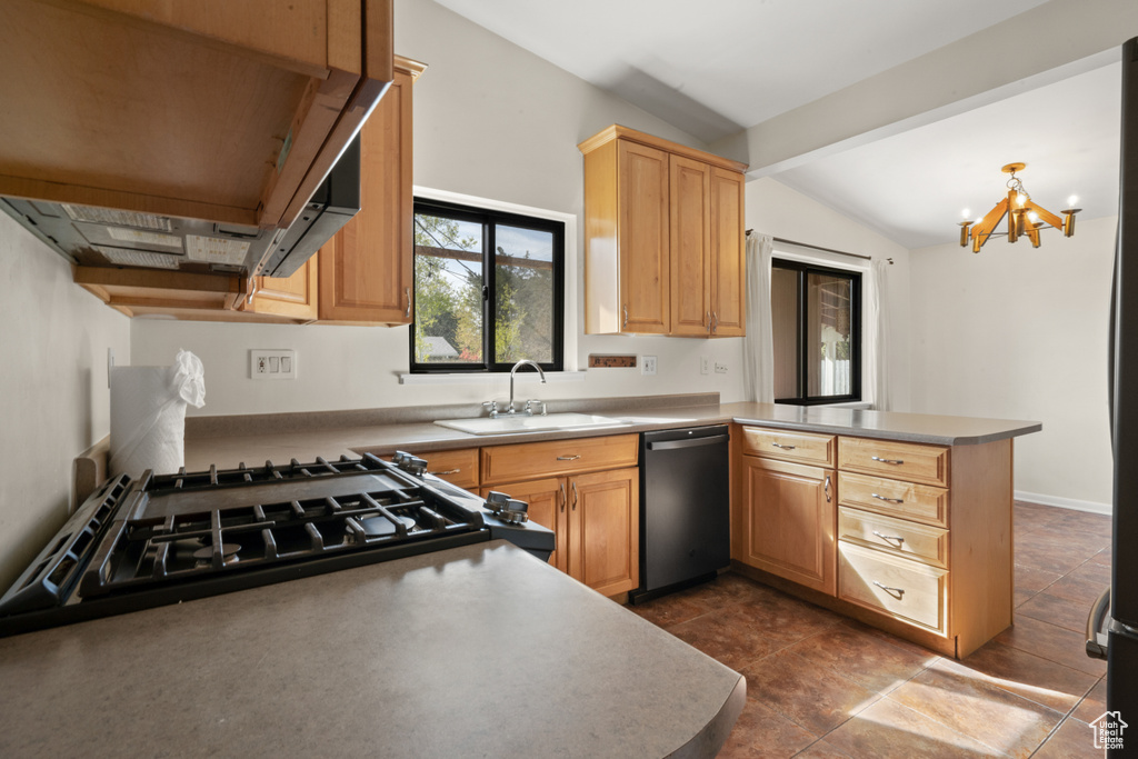 Kitchen with dark tile floors, black dishwasher, kitchen peninsula, and premium range hood
