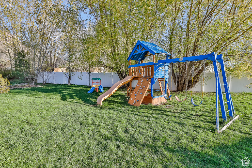 View of playground with a lawn