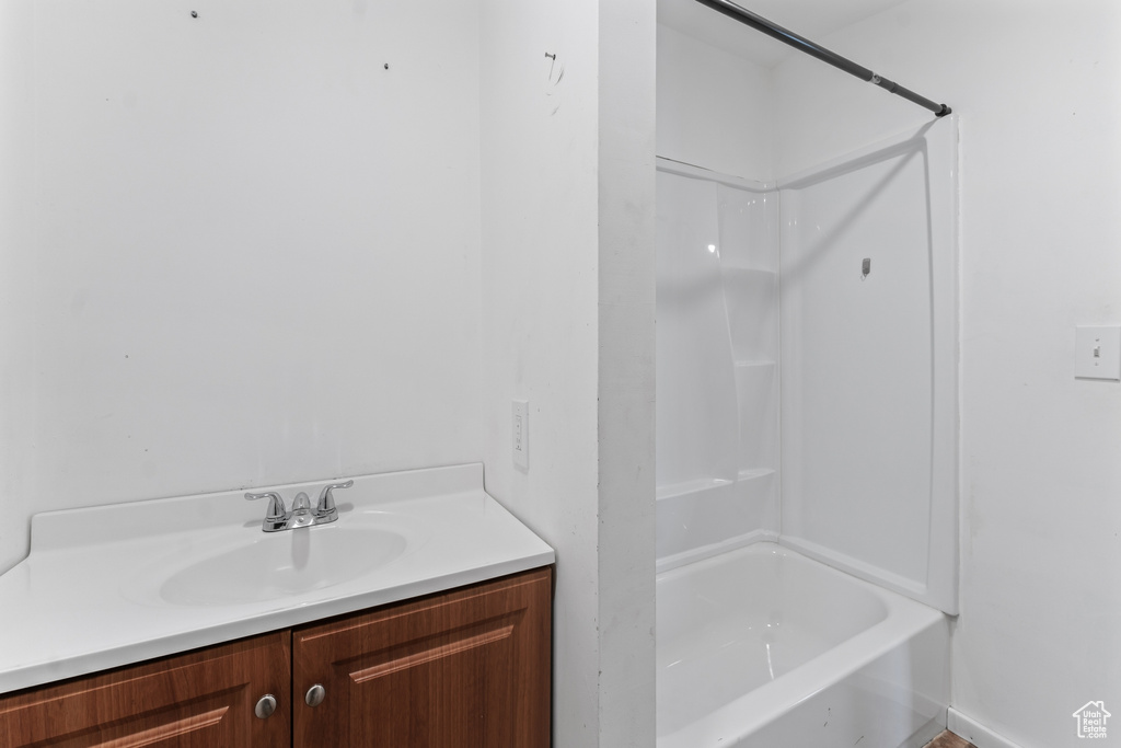 Bathroom with vanity and  shower combination