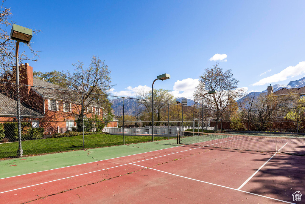View of tennis court featuring a mountain view