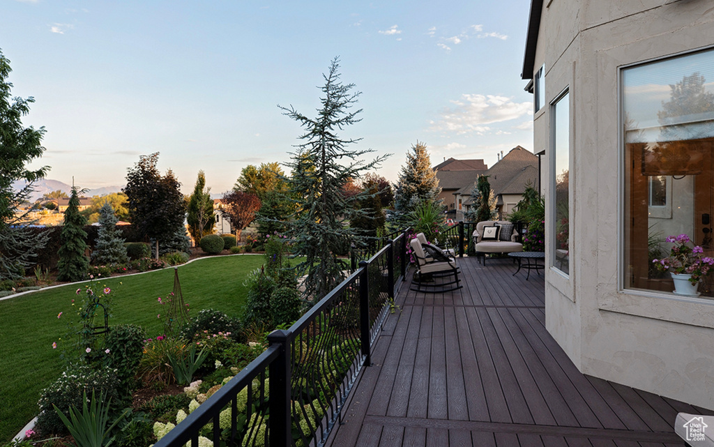 Deck at dusk with a yard