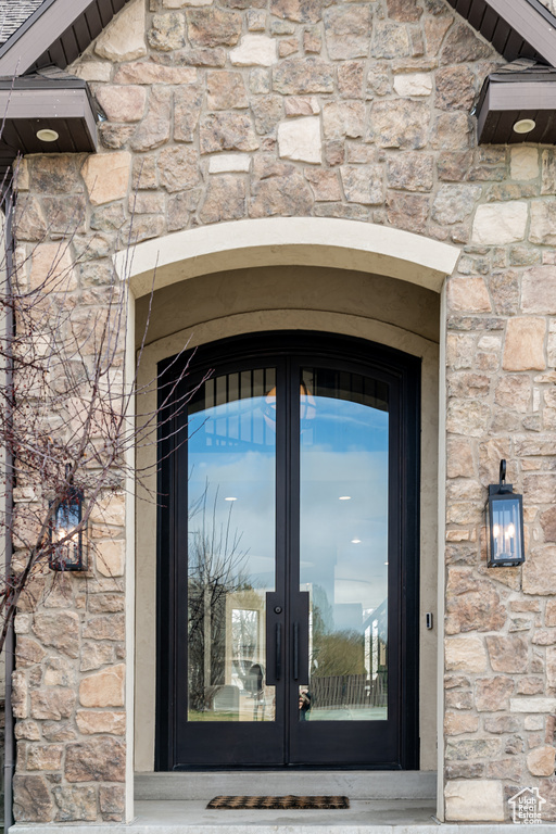 Entrance to property featuring french doors
