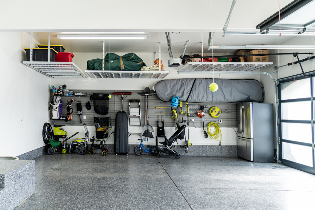 Garage featuring stainless steel refrigerator