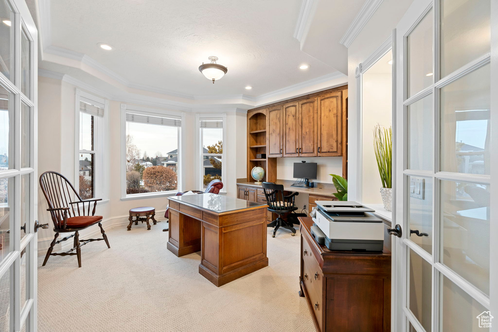 Office featuring light colored carpet, french doors, and ornamental molding