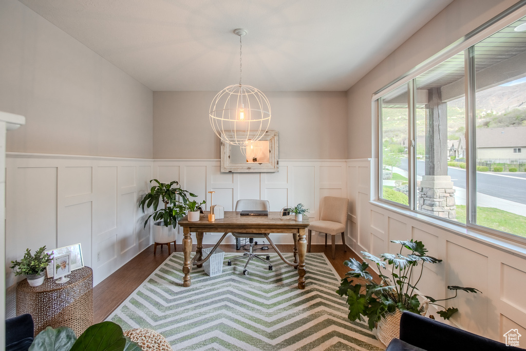 Home office featuring dark hardwood / wood-style flooring