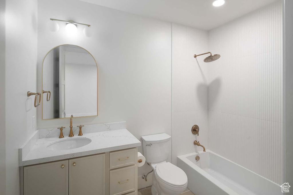 Full bathroom with shower / bathtub combination, toilet, and vanity