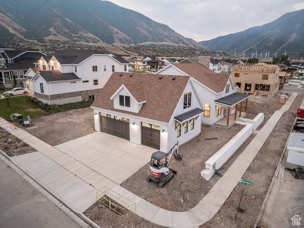 Birds eye view of property with a mountain view