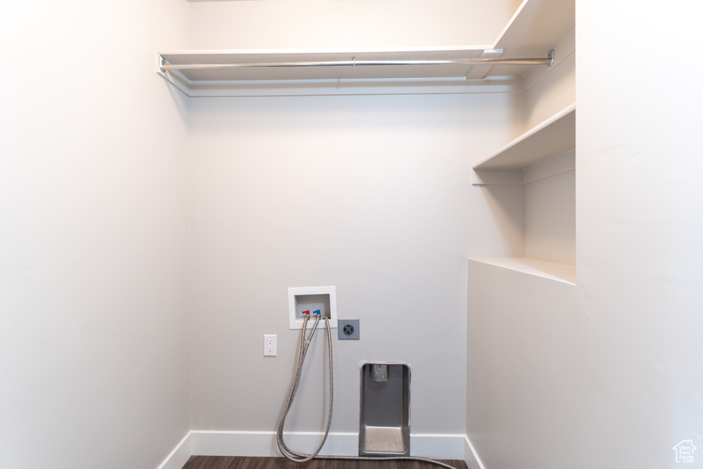 Washroom featuring washer hookup, electric dryer hookup, and dark hardwood / wood-style floors