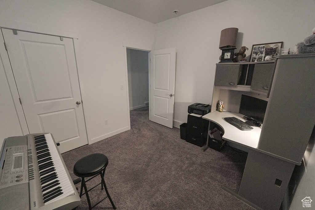 Office with dark colored carpet