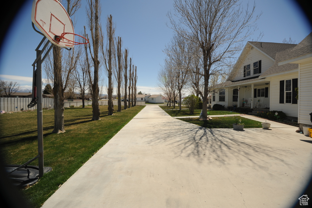 View of yard with basketball court