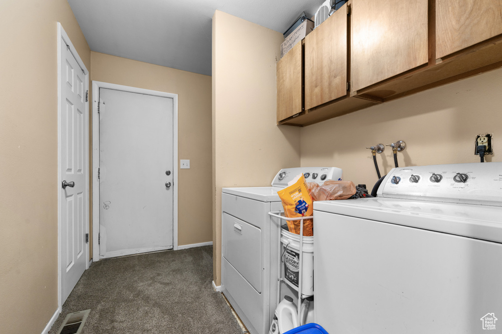 Washroom featuring cabinets, dark carpet, independent washer and dryer, and washer hookup
