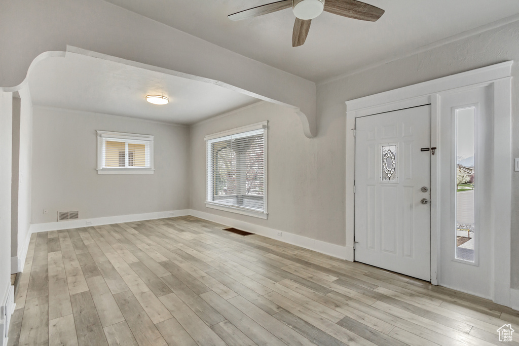 Entrance foyer featuring light hardwood / wood-style flooring and ceiling fan