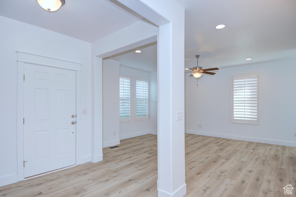 Entrance foyer featuring light hardwood / wood-style flooring and ceiling fan