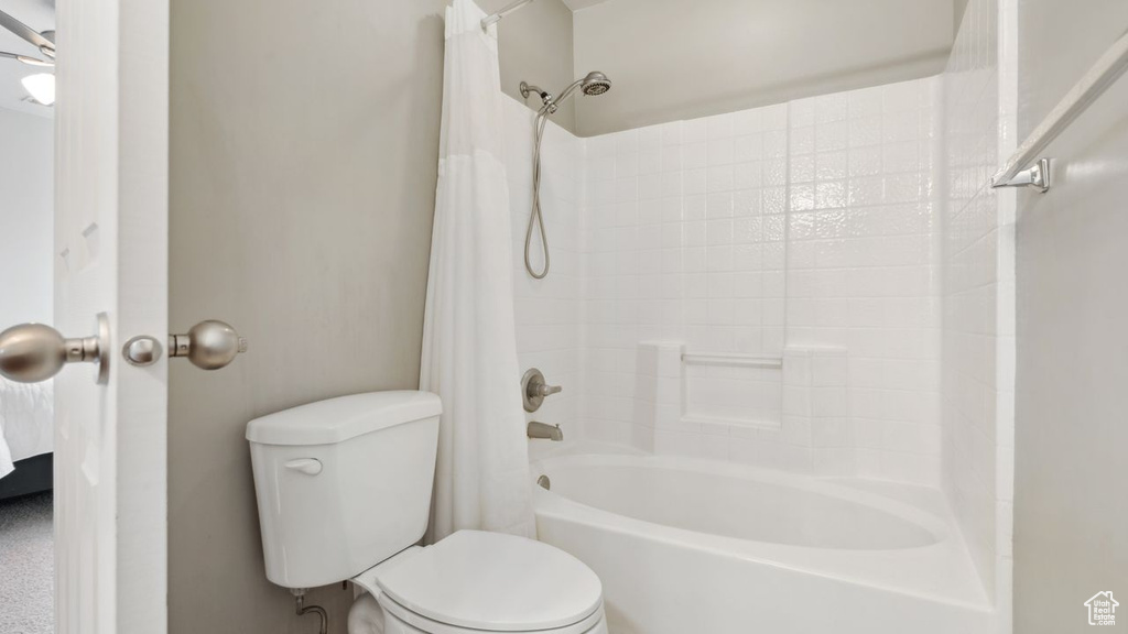 Bathroom with shower / bath combo and toilet