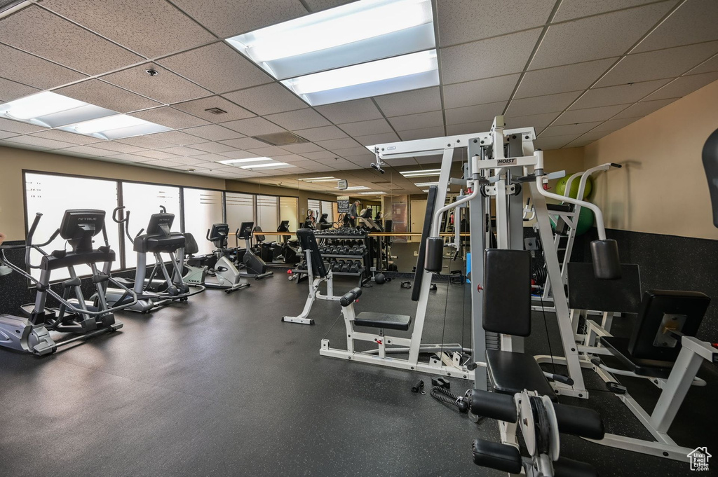 Gym with a paneled ceiling
