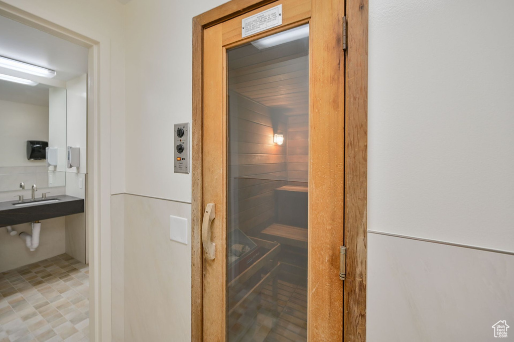 View of sauna / steam room featuring tile floors