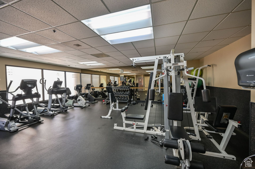 Gym with a paneled ceiling