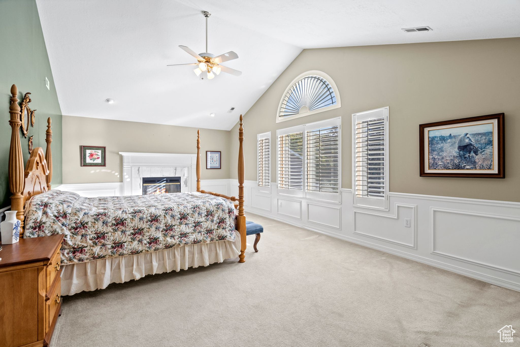 Carpeted bedroom featuring high vaulted ceiling, ceiling fan, and access to outside
