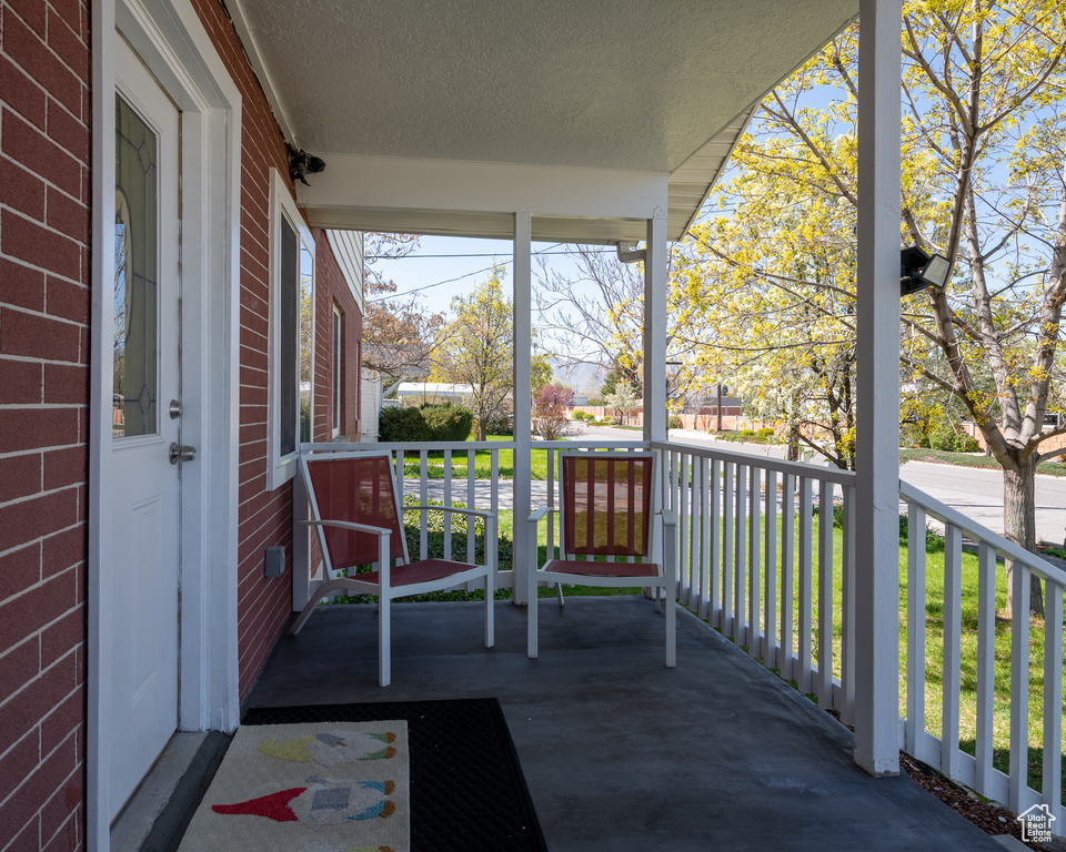 Balcony featuring covered porch