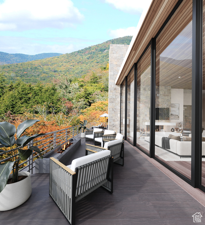 View of terrace featuring a mountain view, a balcony, and outdoor lounge area