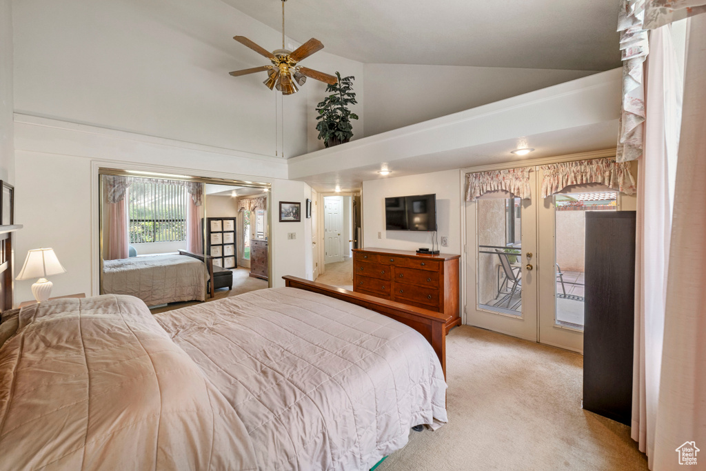 Carpeted bedroom featuring high vaulted ceiling, french doors, ceiling fan, and access to exterior