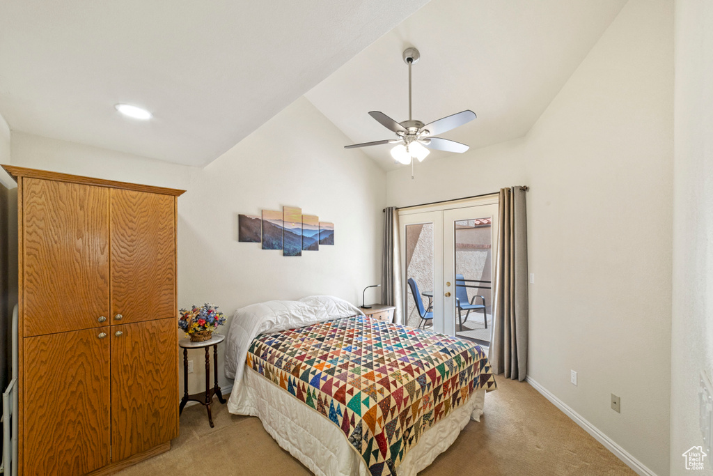 Bedroom featuring light carpet, lofted ceiling, ceiling fan, and access to outside