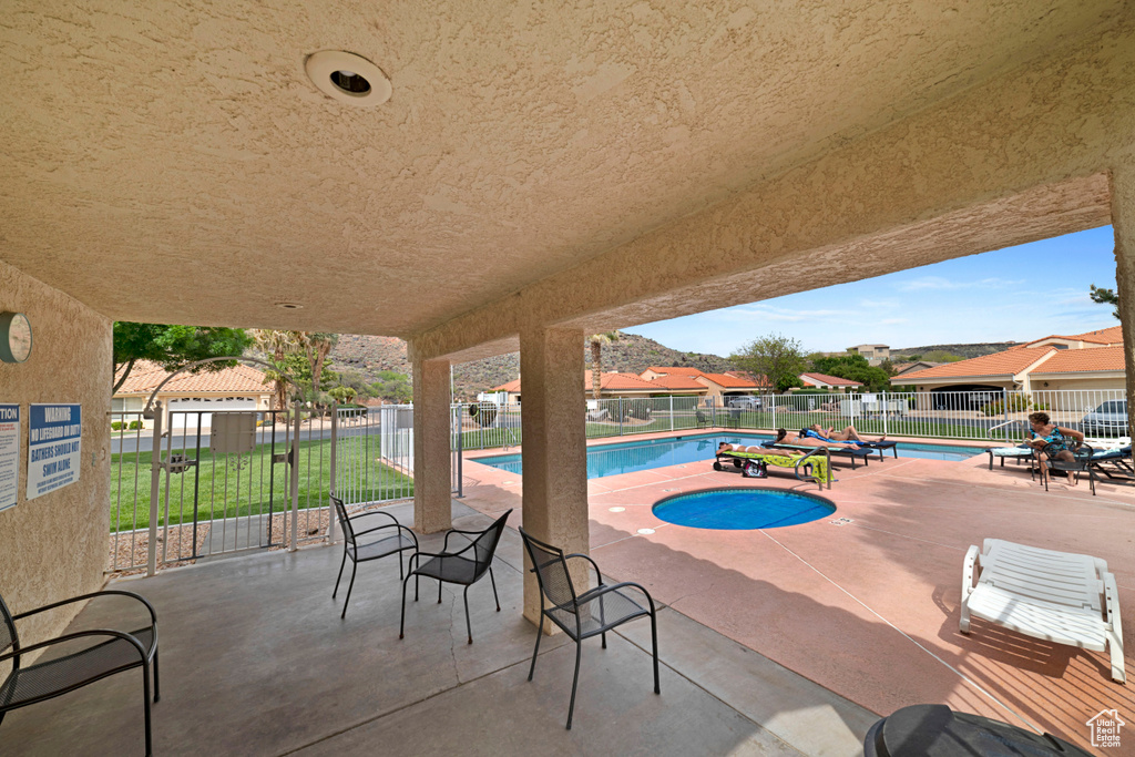 View of patio / terrace with a community pool