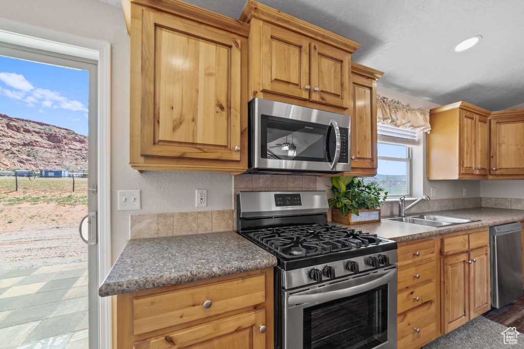 Kitchen featuring stainless steel appliances and sink