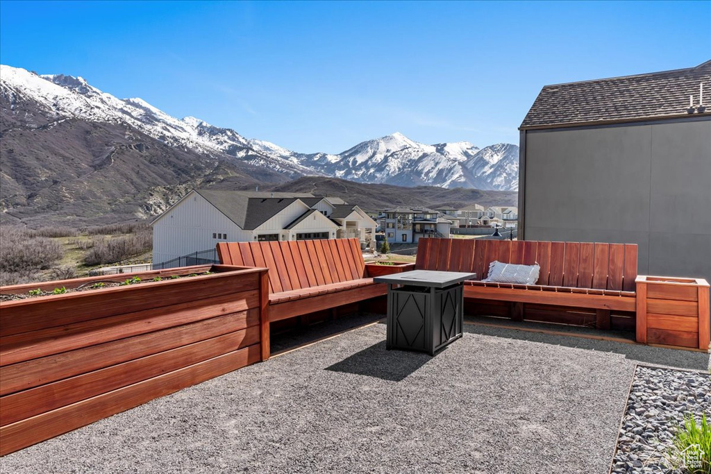 View of terrace with a deck with mountain view